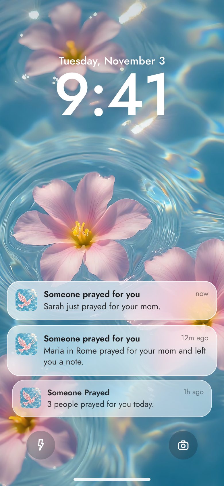 An iPhone lock screen with notifications saying someone prayed for you